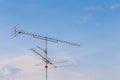 Television antenna on blue sky Royalty Free Stock Photo