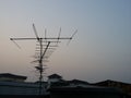 Television antenna on roof top of house Royalty Free Stock Photo