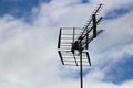 Television antennae on clouded sky Royalty Free Stock Photo