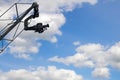 Television camera on a camera crane on a background of sky Royalty Free Stock Photo