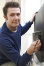 Television Engineer Installing New Television At Home