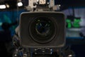 Television studio with camera and lights - recording TV show. Shallow depth of field Royalty Free Stock Photo