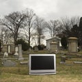 Television in graveyard. Royalty Free Stock Photo
