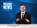 Television presenter in front telling breaking news with blue mo Royalty Free Stock Photo