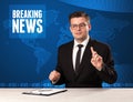 Television presenter in front telling breaking news with blue mo Royalty Free Stock Photo