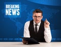 Television presenter in front telling breaking news with blue mo Royalty Free Stock Photo