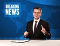 Television presenter in front telling breaking news with blue mo Royalty Free Stock Photo