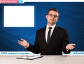 Television reporter telling breaking news at his studio desk wit Royalty Free Stock Photo