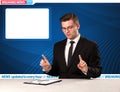 Television reporter telling breaking news at his studio desk wit Royalty Free Stock Photo