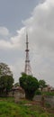 Television Signal Broadcasting Tower with Cloudy Sky