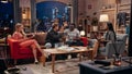 Television Sitcom: Four Diverse Friends Having Fun in the Living Room. Funny TV Show Guys Focused on