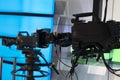 Television studio with camera and lights - recording TV show. Shallow depth of field Royalty Free Stock Photo