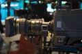 Television studio with camera and lights - recording TV show. Shallow depth of field Royalty Free Stock Photo