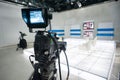 Television studio with camera and lights Royalty Free Stock Photo