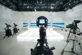 Television studio with camera and lights Royalty Free Stock Photo