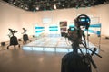 Television studio with camera and lights Royalty Free Stock Photo