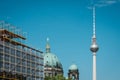 Television Tower, Berlin Cathedral and scaffolding on blue sky in Berlin