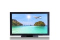 Television TV screen with airplane landing above small island in blue sea landscape picture