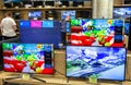 Televisions of different brands in the electronics store. Minsk, Belarus - june 29, 2020