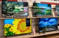 Televisions of different brands on the shelves at the consumer electronics store. Minsk, Belarus, 2023