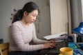 Telework and remote job - lifestyle portrait of young happy and beautiful Asian Chinese woman working on laptop or studying at