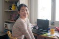 Telework and remote job - lifestyle portrait of young happy and beautiful Asian Korean woman working on laptop at home office desk Royalty Free Stock Photo
