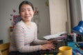 Telework and remote job - lifestyle portrait of young happy and beautiful Asian Korean woman working on laptop at home office desk