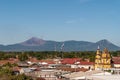 Telica volcano and Iglesia de la Recoleccion seen from top of  Cathedral in Leon, Nicaragua Royalty Free Stock Photo