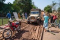 Telimele, Guinea - December 21, 2013: Motorbike, 4x4 vehicle, people crossing river on simple raft, Fouta Djallon