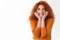 Tell me everything. Cheerful excited redhead female friend wanna know details gossiping, smiling thrilled, touch face