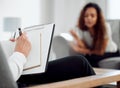 Tell me how youve really been feeling. an unrecognisable psychologist sitting with her patient and taking notes during a