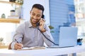 Tell me what you had in mind... a businessman making a note in his diary while talking on the the telephone. Royalty Free Stock Photo