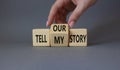 Tell our or my story symbol. Businessman hand turns wooden cubes and changes the words Tell my story to tell our story. Beautiful Royalty Free Stock Photo