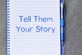 Tell them your story write on notebook