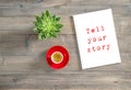 Tell your story workplace flat lay Notebook coffee succulen