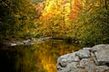 A river winds through the bright colors of autumn. Royalty Free Stock Photo