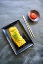 Telur dadar gulung or Tamagoyaki or Japaneses egg roll. Gyeran Mari or Korean Rolled Omelette. fried egg. Royalty Free Stock Photo