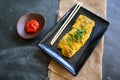 Telur dadar gulung or Tamagoyaki or Japaneses egg roll. Gyeran Mari or Korean Rolled Omelette. fried egg. Royalty Free Stock Photo