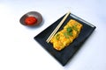 Telur dadar gulung or Tamagoyaki or Japaneses egg roll. Gyeran Mari or Korean Rolled Omelette. fried egg isolate white background. Royalty Free Stock Photo