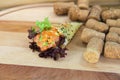 Temaki Sushi salmon Hand Roll wrapped Mamenori seaweed served on wooden board with wine corks on background Royalty Free Stock Photo