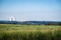 Temelin Nuclear Power Station in Czechia with a green field of flowers under a clear blue sky Royalty Free Stock Photo