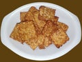 Tempe goreng fried tempeh indonesian vegetarian food. isolated brown background.