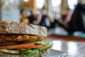 tempeh sandwich with a blurred pilates class going on