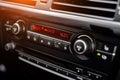 Temperature display on the car`s climate control panel in a blurry background Royalty Free Stock Photo