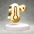 Temperature High icon. Shiny golden Temperature High symbol on white marble podium