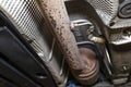 Temperature sensor in the car exhaust system, located behind the diesel particulate filter in a car on a lift in a car workshop, s Royalty Free Stock Photo