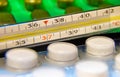 Temperature on the thermometer is 37C, the thermometer lies among the tablets Royalty Free Stock Photo
