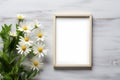 template blank picture frame mockup on white wooden background surrounded by daisies flowers Royalty Free Stock Photo