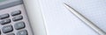 Template with caculator pen notepad on white table top view background. Royalty Free Stock Photo