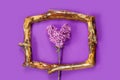 Template for design with vintage wooden frame and branch of lilac in the shape of heart